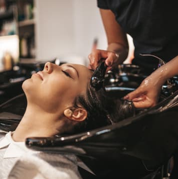 Lady having hair coloured